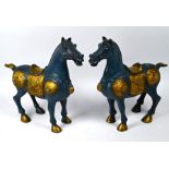 A pair of 20th century painted and gilded brass war horses, Xuande mark, 31 cm high