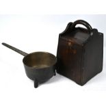 An old cast iron long handled pan on tripod base to/w a Scandinavian flour box