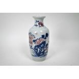 A Chinese underglaze blue and copper red baluster vase, 22 cm high
