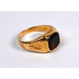 A Victorian yellow gold and garnet set memento mori ring