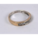 An 18ct yellow gold diamond set half eternity ring