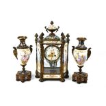 A good 19th century French champleve enamel and gilt metal, four pane clock garniture