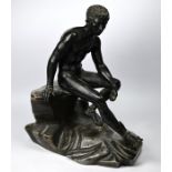 A large bronzed spelter figure of Hermes, seated upon a naturalistic marble rock