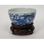 A Chinese blue and white 'dragon' tea bowl, Qianlong mark, 8.5 cm diameter