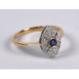 A diamond and sapphire elliptical cluster ring