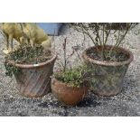 A pair of old lattice design terracotta pots to/with another