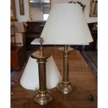 A pair of large brass pillar table-lamps