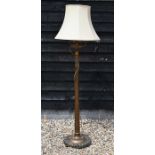 A mahogany turned and fluted standard lamp