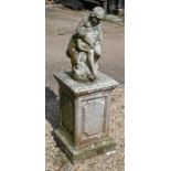 A weathered stone-cast garden figure group on square plinth base