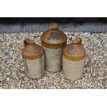 Three large stoneware flagons