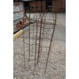 A set of four weathered steel ball-head garden obelisks