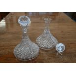 A pair of cut glass ship's decanters with mushroom stoppers