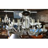 Four various glass framed chandeliers, sizes and designs vary