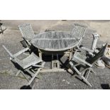 A weathered teak dining set