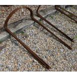 A set of ten weathered steel curved garden plant frames