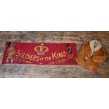 An antique embroidered red felt banner