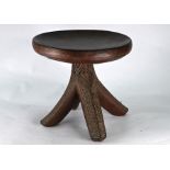 An old carved hardwood tripod stool of African origin