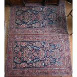 A companion pair of antique Persian Kashan rugs, circa 1920s