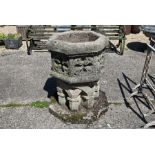 A large weathered reconstituted stone font planter in the Gothic style, 20th century