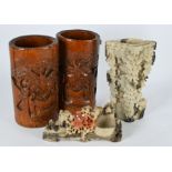 A pair of Chinese bamboo brush pots and two soapstone carvings