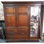 A late Victorian oak triple door compactum