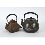 Two 19th century Japanese iron tetsubin, Meiji period
