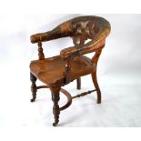 A Victorian mahogany chair with buttoned brown leather yoke back