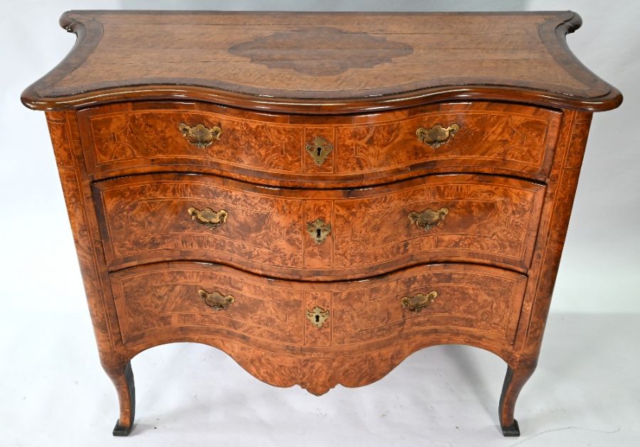 An 18th century continental serpentine commode