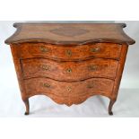 An 18th century continental serpentine commode