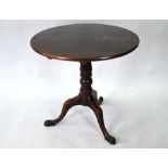 A Georgian mahogany circular tilt-top tripod table