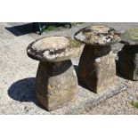 A pair of antique weathered staddle stones