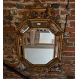 A 19th century bevel edged cushion framed gilt-wood and composite wall mirror