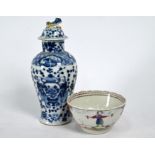 An 18th century Chinese famille rose tea bowl and blue and white vase with Kangxi mark