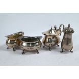 Silver cream jug and various condiments