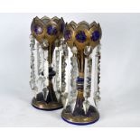 A pair of 19th century Bohemian overlaid glass lustre-vases