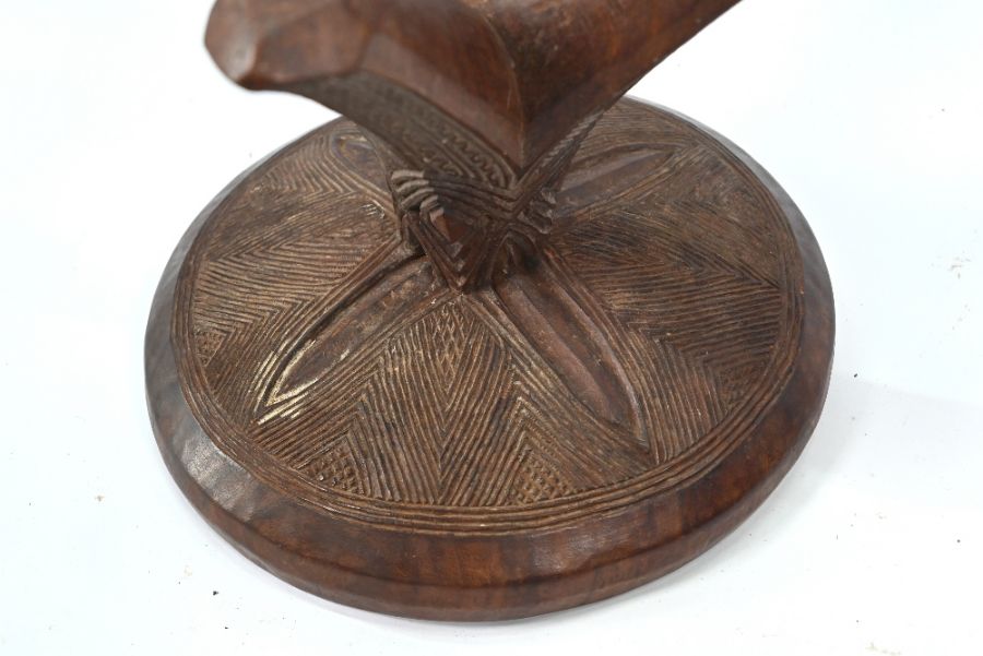 An old carved hardwood tripod stool of African origin - Image 5 of 5