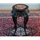 An antique Chinese carved rosewood stand