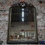 A large French antique black/gilt mirror in Napoleon III style