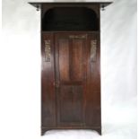An Art & Crafts oak hall cupboard in the manner of Liberty & Co