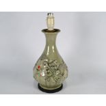 A Chinese celadon 'dragon' vase mounted as a lamp, 38 cm high