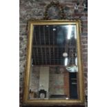 An antique gilt framed trumeau mirror