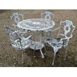 A Victorian style white painted cast metal patio set