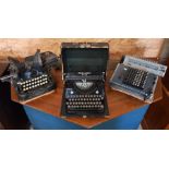 Three typewriters/calculating machines