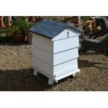 A white painted sectional bee hive