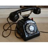 A vintage enamelled metal and bakelite telephone (modern wired)