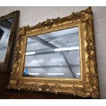 A gilt wood and gesso framed wall mirror, 95 cm x 80 cm