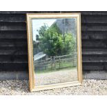 A large rectangular gilt framed bevelled edged mirror