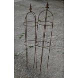 A pair small weathered steel arrow head obelisks