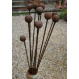 A set of ten weathered steel ball head garden ground spikes