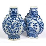 A pair of 19th century Chinese blue and white moonflask vases, late Qing, 21 cm high